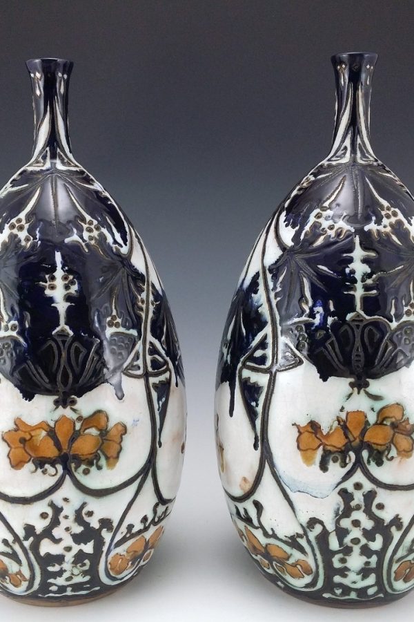 a pair Distel Theo Nieuwenhuis curduus vases with butterflies and magnolia circa 1914