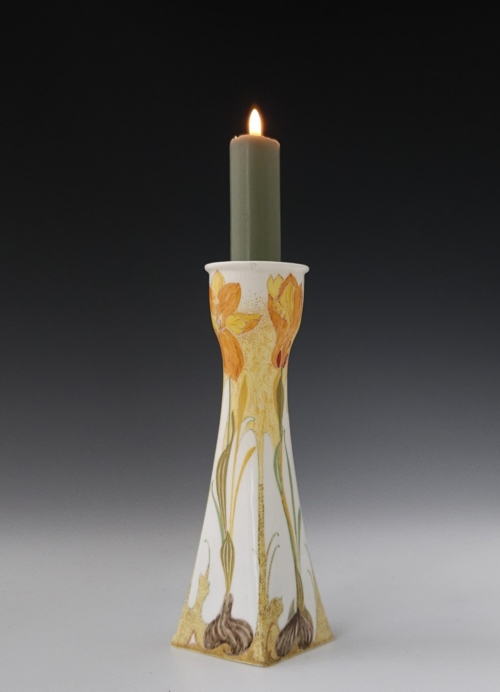 a Rozenburg Den Haag eggshell porcelain candlestick by Sam Schellink 1905